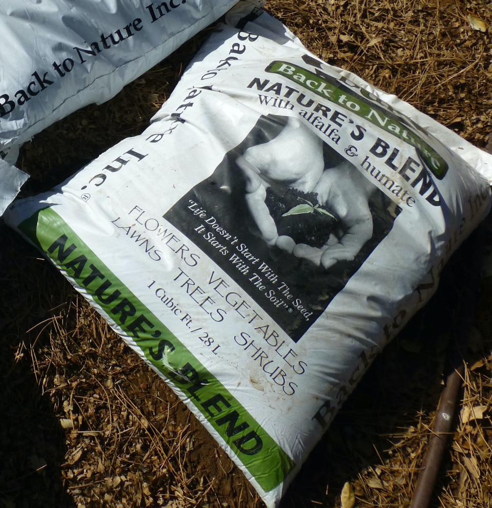 Commercial products like this alfalfa and humate compost are eligible for vegan gardening.