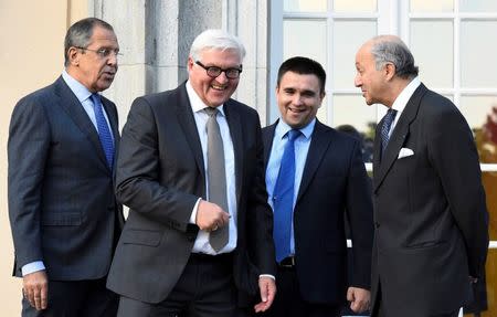 REFILE - Foreign ministers (L-R) Sergei Lavrov of Russia, Frank-Walter Steinmeier of Germany, Pavlo Klimkin of Ukraine and Laurent Fabius of France arrive for a picture opportunity ahead of their meeting at the German foreign ministry's Villa Borsig at lake Tegel in Berlin, Germany September 12, 2015. REUTERS/Tobias Schwarz/Pool