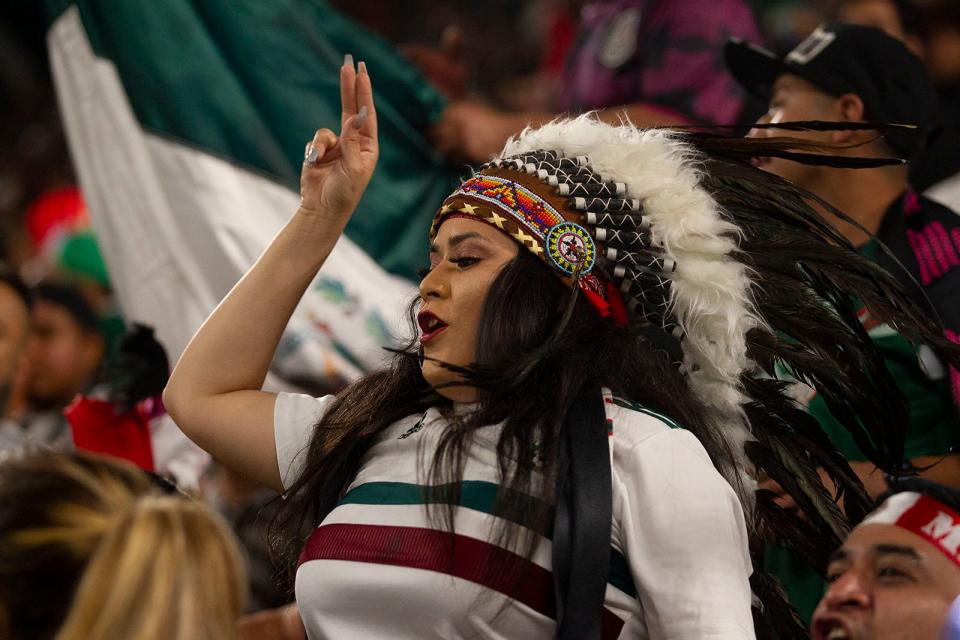 A Mexico fan cheers during the team's exhibition match versus Chile at Q2 Stadium on Wednesday. The game marked the first time the Mexican men's national soccer team played in Austin.