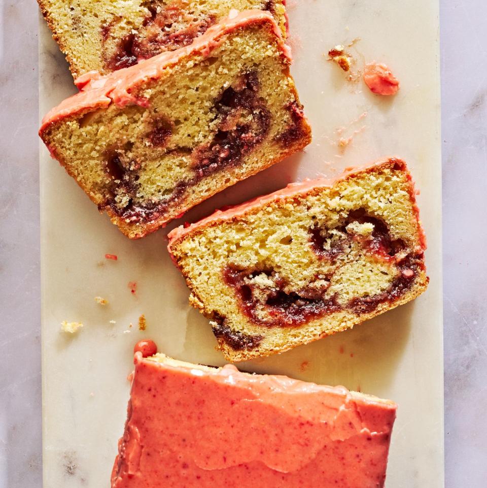 pound cake with a strawberry swirl and topped with a bright pink strawberry glaze