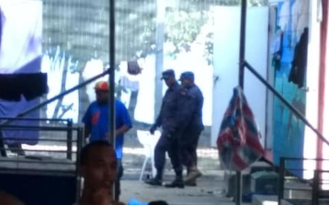 Police enter the Manus Island detention centre on Manus Island, Papua New Guinea - Credit: Reuters