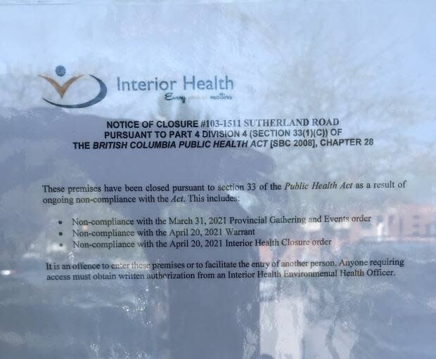 Interior Health's closure notice posted on Flow Academy's door says the business failed to follow the authority's closure order issued on April 20.