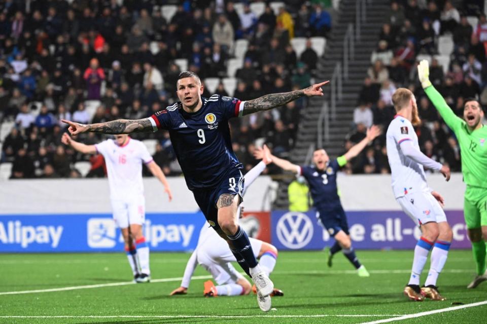 Lyndon Dykes celebrates scoring Scotland’s winner against Israel  (Getty)