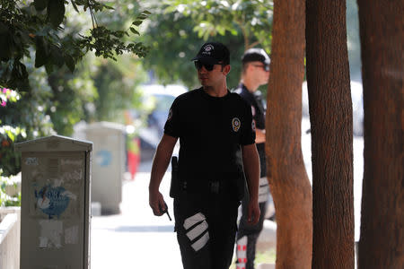 Police officers patrol outside the home of U.S. pastor Andrew Brunson in Izmir, Turkey August 18, 2018. REUTERS/Osman Orsal