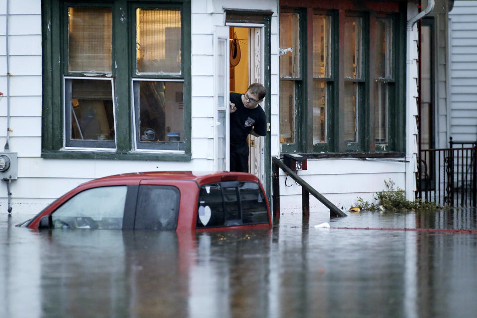 A man in a home along High St. waits for rescuers to come back for him after overnight thunderstorms flooded much of Westville, N.J. on Thursday, June 20, 2019. (Photo: Elizabeth Robertson/The Philadelphia Inquirer via AP)