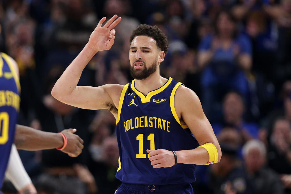 SAN FRANCISCO, CALIFORNIA - MARCH 26:  Klay Thompson #11 of the Golden State Warriors reacts after making a three-point basket against the Minnesota Timberwolves in the first half at Chase Center on March 26, 2023 in San Francisco, California. NOTE TO USER: User expressly acknowledges and agrees that, by downloading and or using this photograph, User is consenting to the terms and conditions of the Getty Images License Agreement.  (Photo by Ezra Shaw/Getty Images)