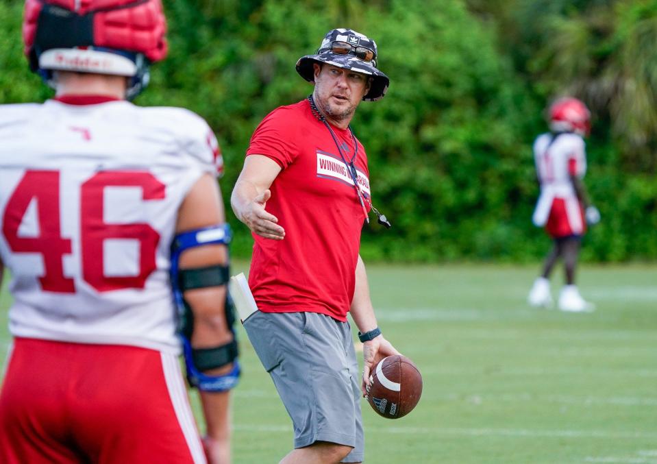 Florida Atlantic head coach Tom Herman works with the defense during practice at the Schmidt Family Complex, Thursday, August 3, 2023 in Boca Raton.