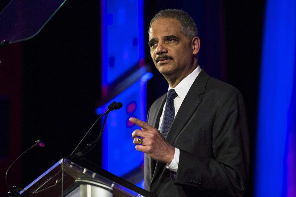 United States Attorney General Eric Holder speaks during the Human Rights Campaign's 13th annual Greater New York Gala in the Manhattan borough of New York, February 8, 2014. Holder plans widespread changes within the U.S. Justice Department to benefit same-sex married couples, such as recognizing a legal right for them not to testify against each other in civil and criminal cases. REUTERS/Keith Bedford (UNITED STATES - Tags: POLITICS CRIME LAW)