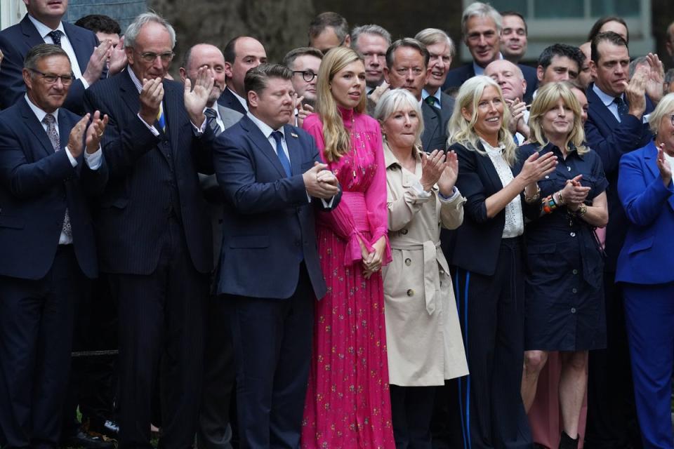 Carrie Johnson, the wife of outgoing prime minister Boris Johnson, joins well-wishers, including Nadine Dorries and Rachel Johnson in Downing Street (PA)