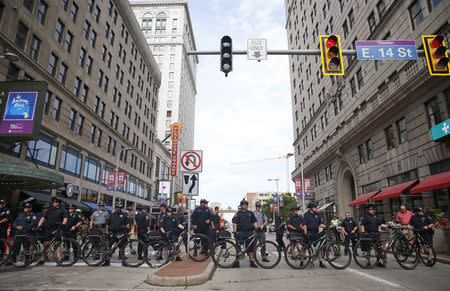 Police block a downtown street with their bicycles during a march by various groups, including "Black Lives Matter" and "Shut Down Trump and the RNC". REUTERS/Shannon Stapleton