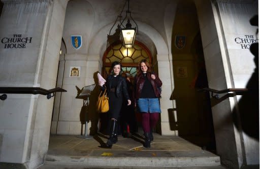 Female members of the clergy leave after the Church of England's draft legislation approving women bishops failed to pass during the England General Synod at Church House in central London