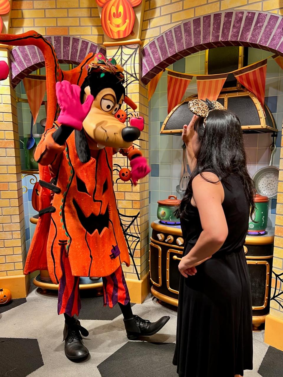 Goofy goes in for a high five in his Halloween Best at Goofy's Kitchen at the Disneyland Hotel.