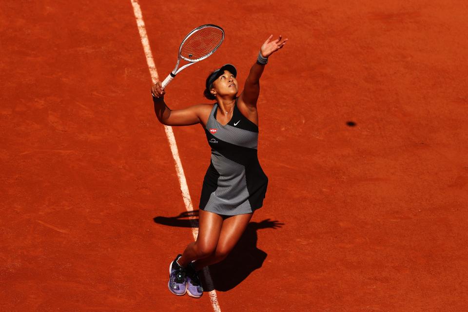 <p>Naomi Osaka serves in her first round match against Patricia Maria Tig at the French Open</p> (Getty Images)