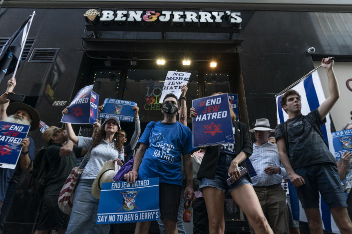 At a rally at a Ben & Jerry&#39;s store, protesters carry signs reading End Jew Hatred &#x002014; Say No to Ben & Jerry&#39;s.