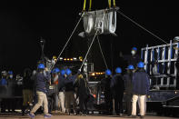 A Beluga whale is transported at Mystic Aquarium after arriving from Canada, Friday, May 14, 2021 in Mystic, Conn. A total of five Beluga whales from Marineland in Niagara Falls, Ontario,Canada will be moved to the aquarium. The whales will be leaving an overcrowded habitat with about 50 other whales and will be at the center of important research designed to benefit Belugas in the wild. (AP Photo/Jessica Hill)