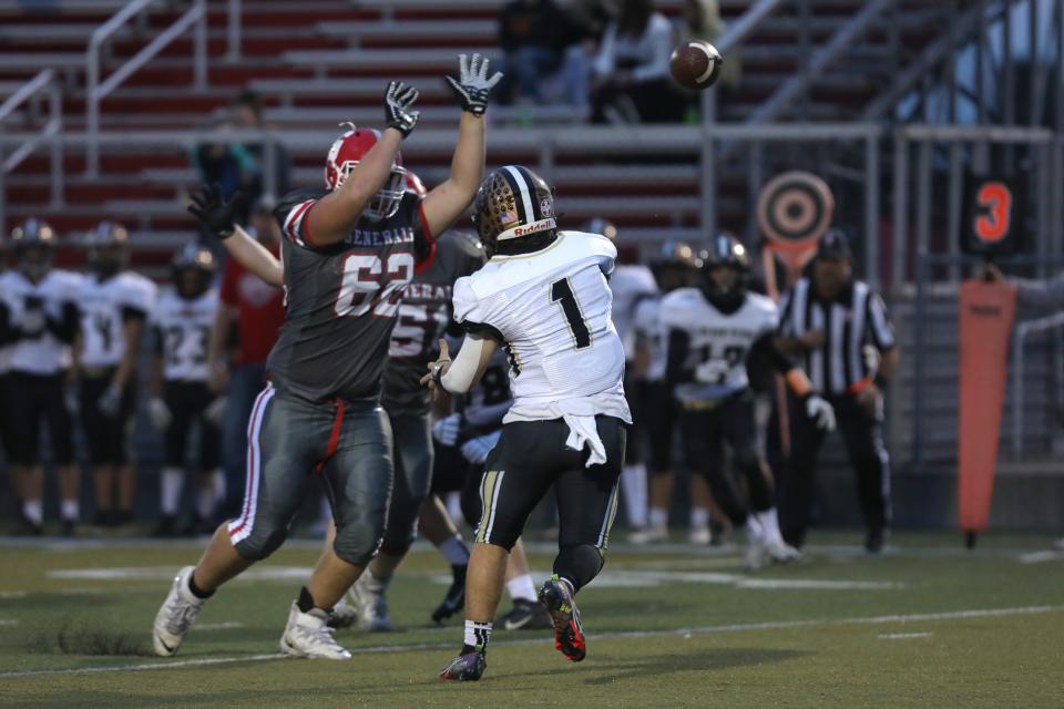 Sheridan's Reece Hale tries to disrupt a pass by River View's Ethan Jordan.