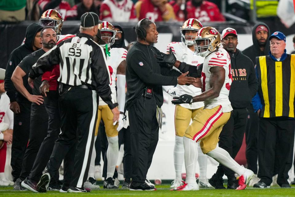 San Francisco 49ers linebacker Dre Greenlaw, right, reacts after being ejected from the game during the second half of an NFL football game against the Philadelphia Eagles, Sunday, Dec. 3, 2023, in Philadelphia. (AP Photo/Matt Slocum)