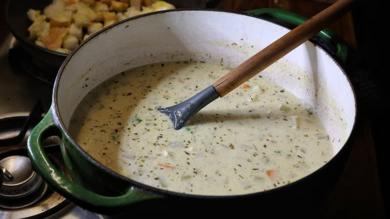 pot of creamy soup with ladle
