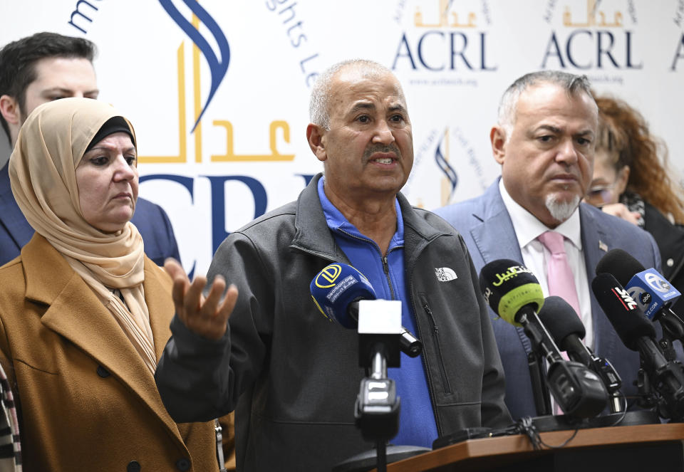 U.S. Citizens Zakaria Alarayshi, center, and his wife Laila Alarayshi, left, of Livonia, Mich., with Arab-American Civil Rights League founder Nabih Ayad, right, talk about their ordeal and experience of being stuck in Gaza during a press conference at the ACRL office, Wednesday, Nov. 8, 2023, in Dearborn, Mich. (Clarence Tabb Jr./Detroit News via AP)