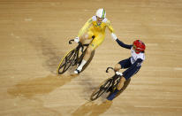 Australia's Anna Meares (in yellow) shakes hands with Britain's Victoria Pendleton after their track cycling women's sprint finals at the Velodrome during the London 2012 Olympic Games August 7, 2012. Meares won the gold medal. REUTERS/Paul Hanna (BRITAIN - Tags: OLYMPICS SPORT CYCLING) 