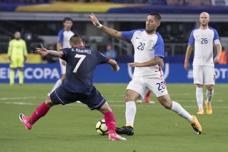 Jul 22, 2017; Arlington, TX, USA; Costa Rica forward David Ramirez (7) defends against United States forward Clint Dempsey (28) during the second half at AT&T Stadium. The United States shut out Costa Rica 2-0. Mandatory Credit: Jerome Miron-USA TODAY Sports