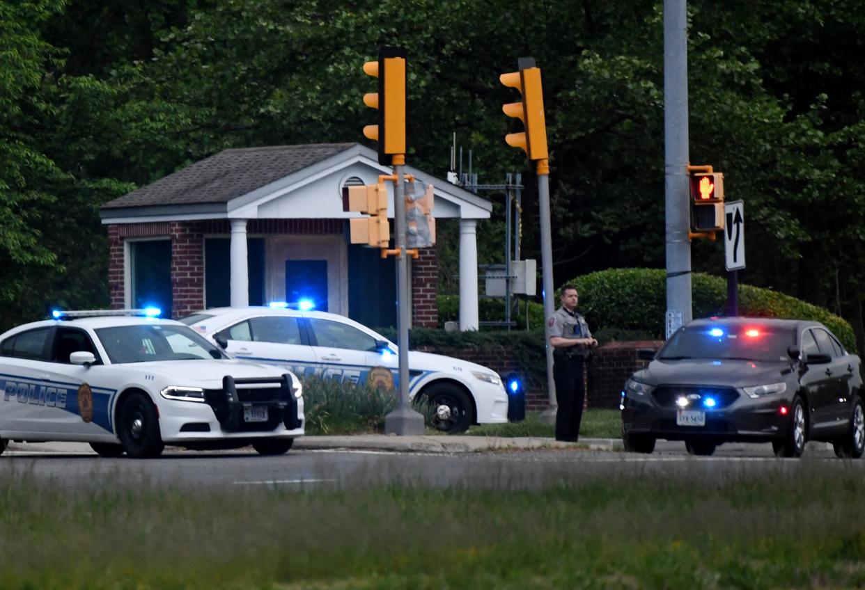 <p>Police cars are seen outside the CIA headquarters's gate after an attempted intrusion earlier in the day in Langley, Virginia, on May 3, 2021</p> (OLIVIER DOULIERY/AFP via Getty Images)