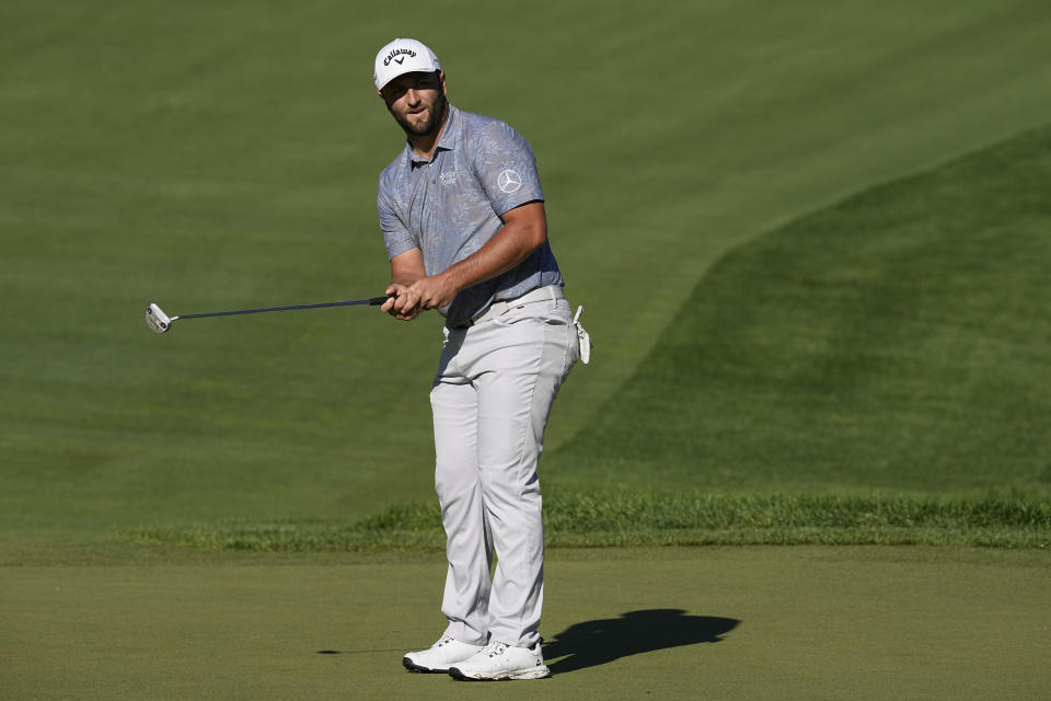 Jon Rahm, of Spain, watches his putt on the 13th green during the second round of the Memorial golf tournament Friday, June 3, 2022, in Dublin, Ohio. (AP Photo/Darron Cummings)