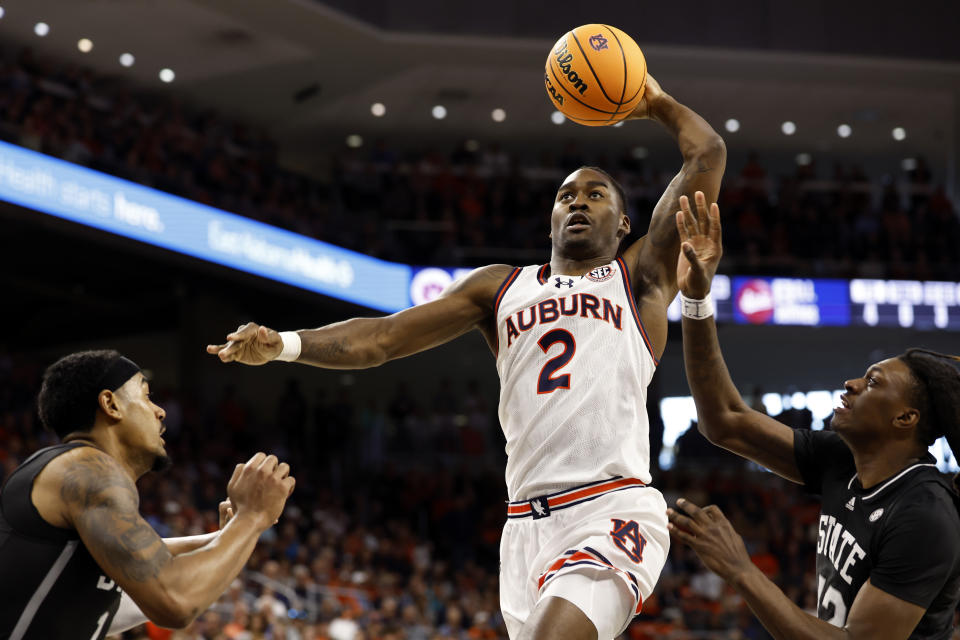 Auburn forward Jaylin Williams (2) goes up for a slam dunk against Mississippi State during the second half of an NCAA college basketball game, Saturday, March 2, 2024, in Auburn, Ala. (AP Photo/ Butch Dill)