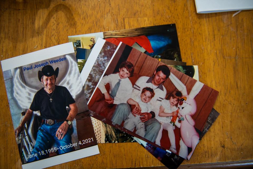 Photos of Paul Weeden Sr. lay on a table in Paul Weeden Jr's home in Livingston Manor, NY on Monday, March 28, 2022.