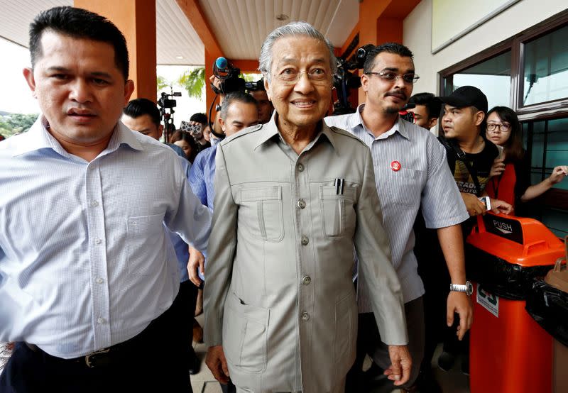 FILE PHOTO: Former Malaysian Prime Minister Mahathir Mohamad arrives to visit jailed opposition leader Anwar Ibrahim, who is recuperating from surgery, at Cheras Rehabilitation Hospital in Kuala Lumpur