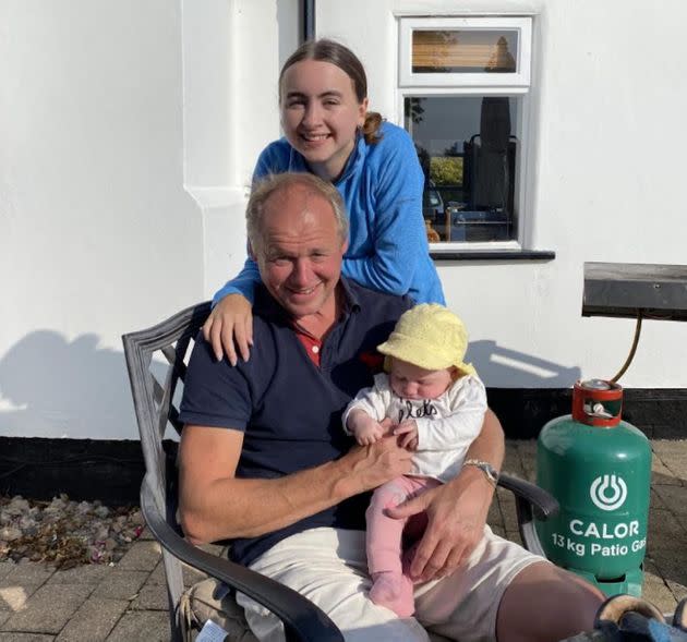 The author with her dad and her baby sister in her dad's garden in September 2020. (Photo: Courtesy of Laura Purkess)