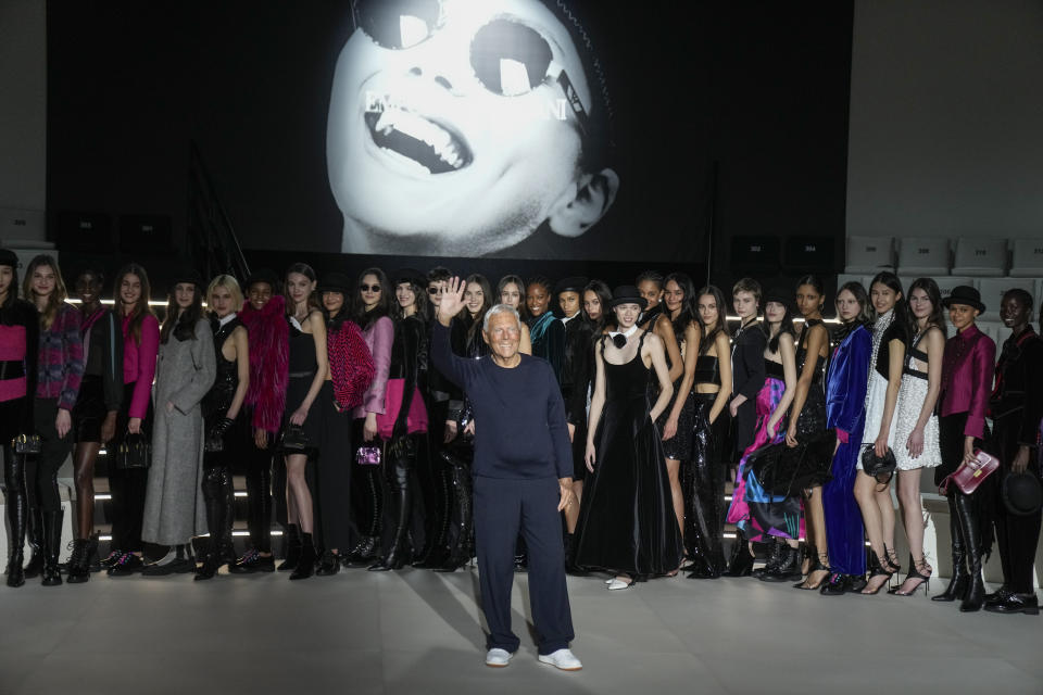 Designer Giorgio Armani accepts applause at the end of the Emporio Armani women's Fall-Winter 2023-24 collection presented in Milan, Italy, Thursday, Feb. 23, 2023. (AP Photo/Antonio Calanni)