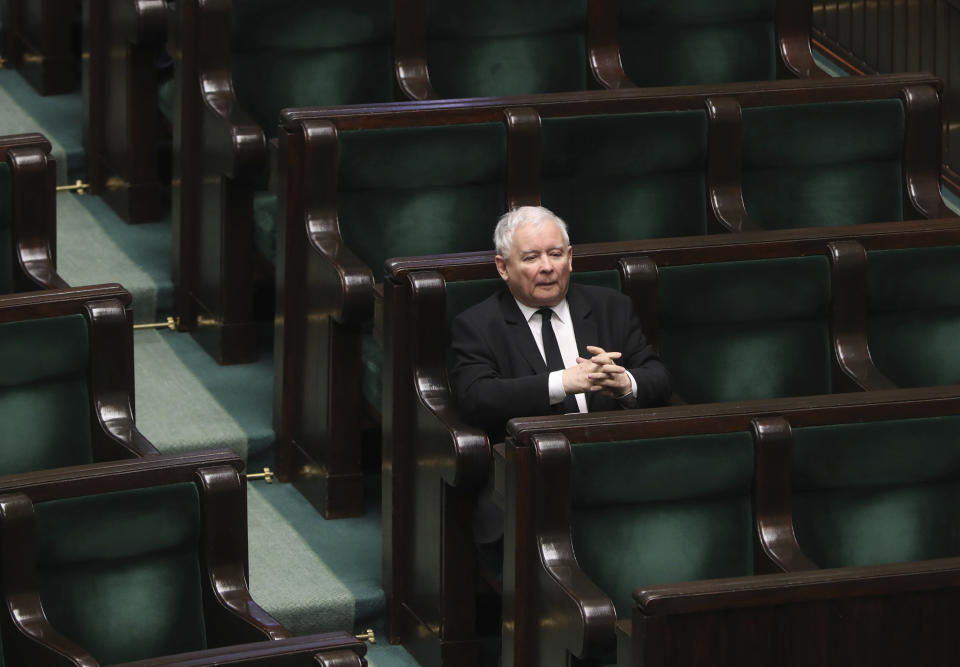 Jaroslaw Kaczynski, leader of the conservative ruling party Law and Justice, takes part in a parliamentary session in Warsaw, Poland, Friday, April 3, 2020. Uncertainty deepened in Poland on Friday over whether the country will move forward with a presidential election scheduled for May despite the coronavirus pandemic. Kaczynski had hoped to move forward with the vote despite the epidemic by having a postal election, but the head of a faction in his coalition is opposed and wants the elections postponed by two years. (AP Photo/Czarek Sokolowski)