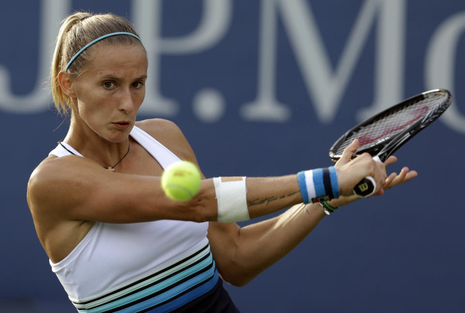 Slovenia's Polona Hercog returns a shot to Ekaterina Makarova, of Russia, during the first round of the 2013 U.S. Open tennis tournament, Monday, Aug. 26, 2013, in New York. (AP Photo/Darron Cummings)