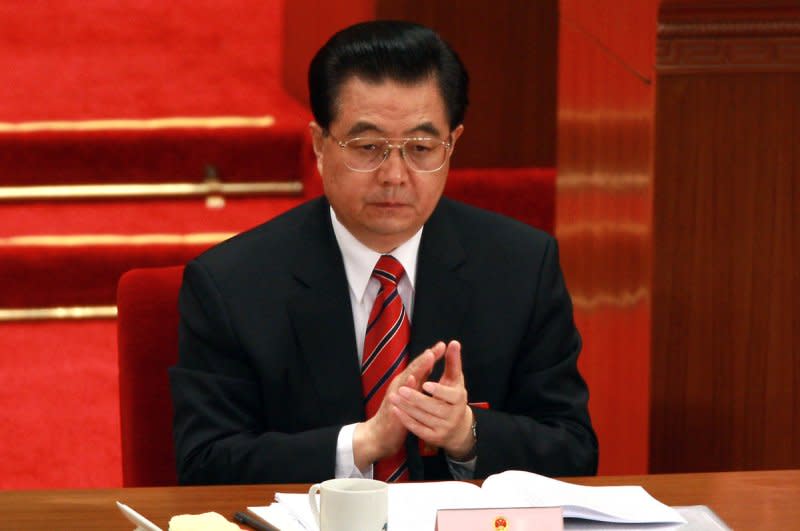 Chinese President Hu Jintao listens to Premier Wen Jiabao deliver his government report to delegates during the opening ceremony of the National People's Congress at the Great Hall of the People in Beijing March 5, 2008. On March 15, 2003, Hu replaced Jiang Zemin as president of China. File Photo by Stephen Shaver/UPI
