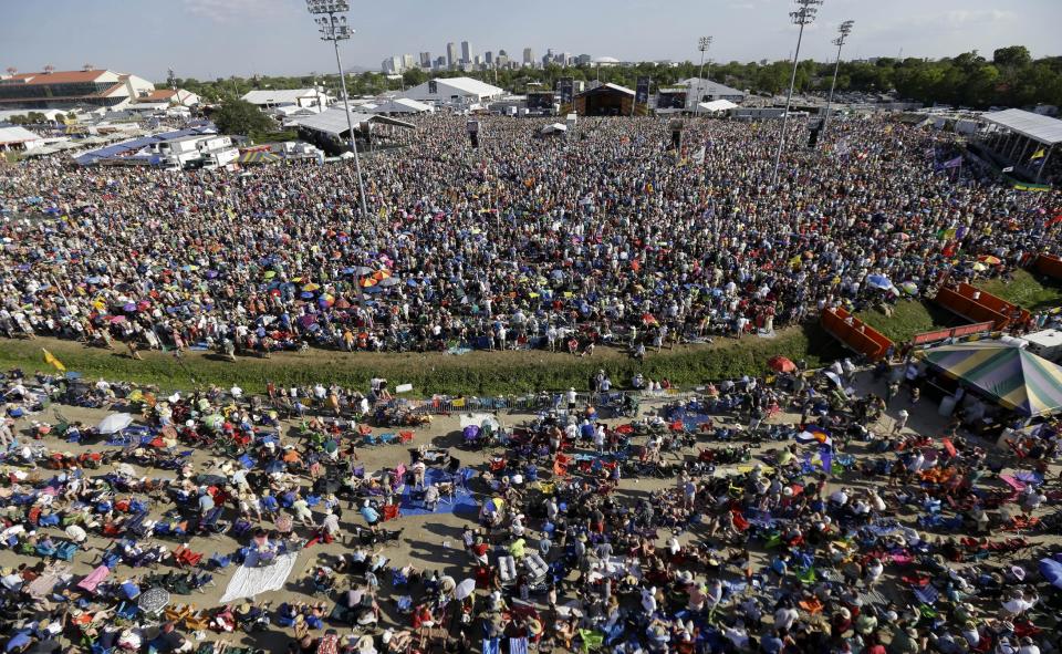 The skyline of New Orleans is seen as crowds watch Bruce Springsteen perform at the New Orleans Jazz and Heritage Festival in New Orleans, Saturday, May 3, 2014. (AP Photo/Gerald Herbert)