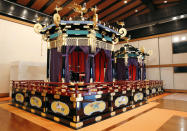 This Saturday, Oct. 19, 2019, photo shows Takamikura throne with Michodai, right, a curtained platform, placed at Imperial Palace in Tokyo. The Takamikura throne will be used at a ceremony for Emperor Naruhito's proclamation on Oct. 22, 2019. (Kyodo News via AP)