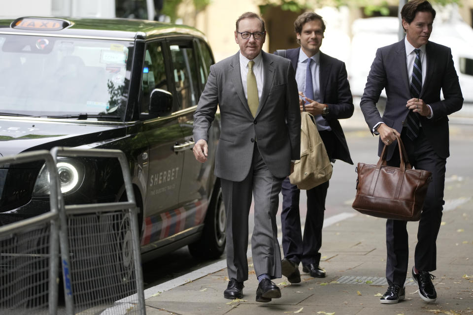 Actor Kevin Spacey, left, arrives at Southwark Crown Court in London, Friday, June 30, 2023. Spacey is going on trial on charges he sexually assaulted four men as long as two decades ago. The double-Oscar winner faces a dozen charges at Southwark Crown Court. Spacey pleads not guilty to all charges. (AP Photo/Kin Cheung)