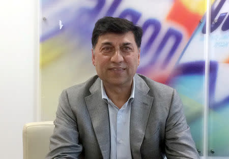 FILE PHOTO: Rakesh Kapoor, the CEO of Reckitt Benckiser, poses for a photograph at the company headquarters in Slough, Britain August 14, 2017. REUTERS/Martinne Geller/File Photo