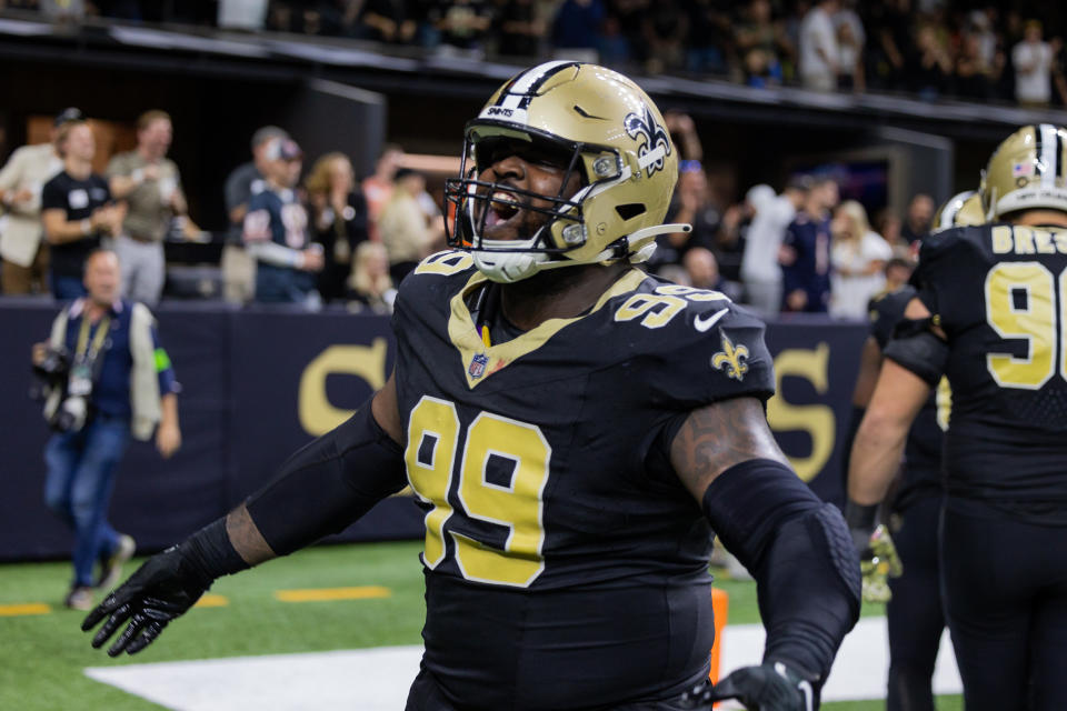 Nov 5, 2023; New Orleans, Louisiana, USA; New Orleans Saints defensive tackle Khalen Saunders (99) shows emotion after an interception against the Chicago Bears during the second half at the Caesars Superdome. Mandatory Credit: Stephen Lew-USA TODAY Sports
