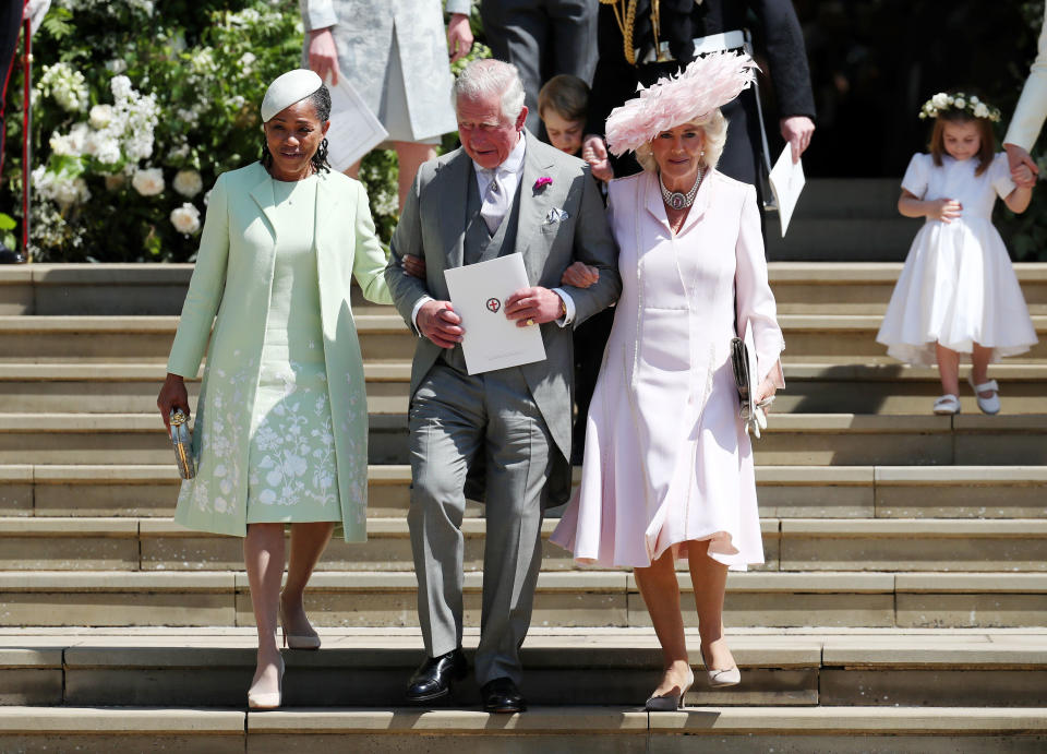 Meghan Markle's mother, Doria Ragland, left. leaves the church after the ceremony with Prince Charles and the Duchess of Cornwall (Picture: PA)