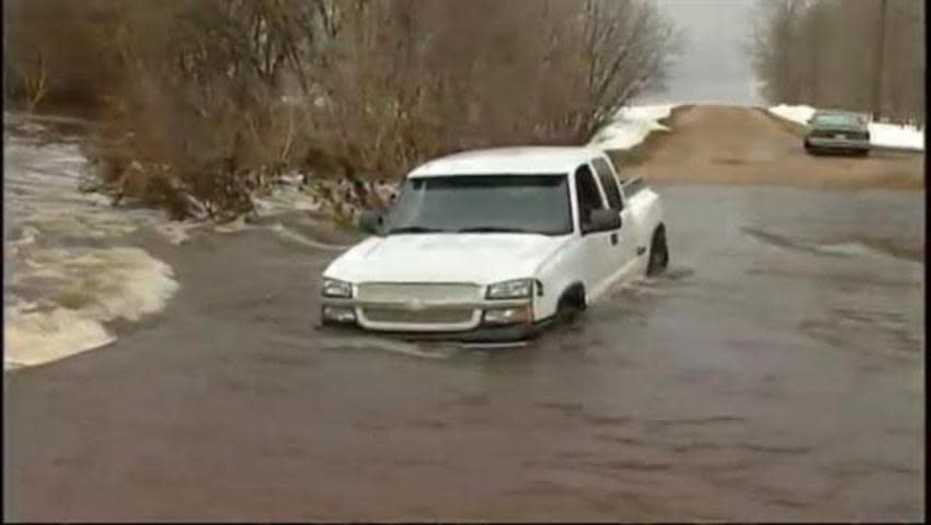 Girl rescued from icy flood waters in Manitoba