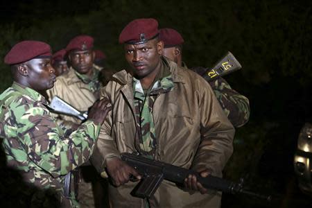 Kenyan soldiers hold their rifles near the Westgate shopping centre in Nairobi September 23, 2013. REUTERS/Karel Prinsloo