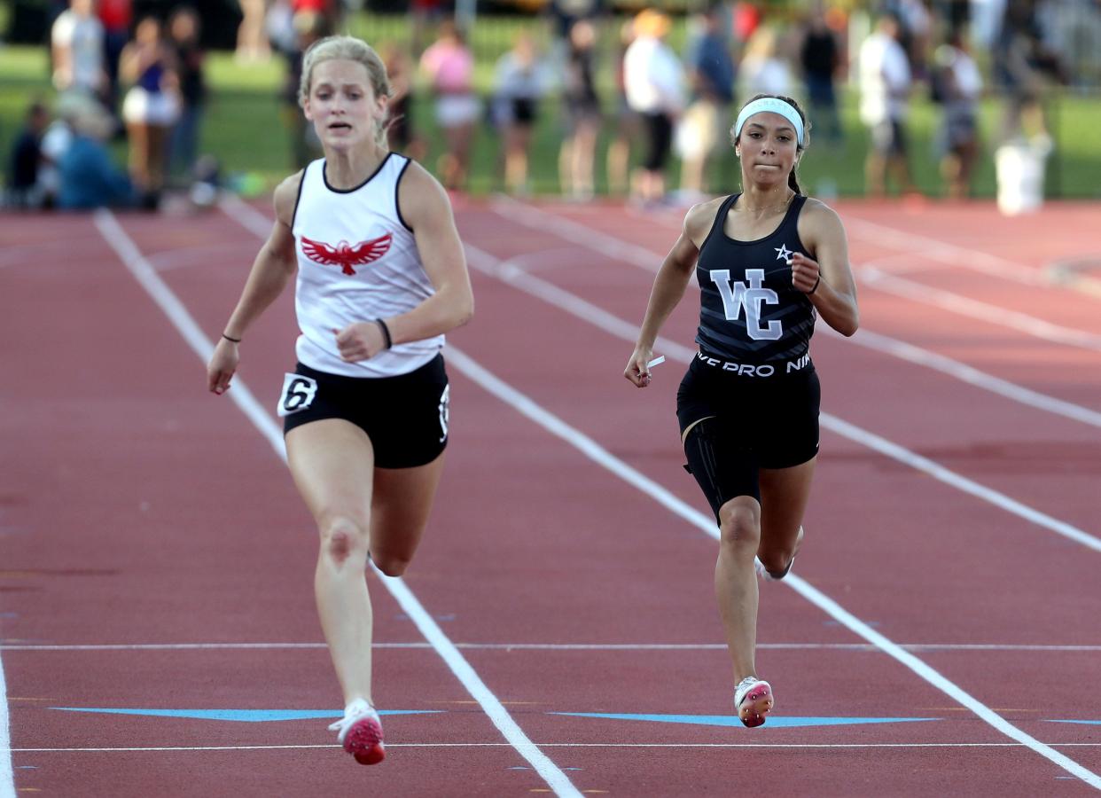Central's Olivia Pace and Milford's Meredith Goff compete in the 200 meters at the Division I state meet. Pace finished second in the 100 and seventh in the 200, helping the Warhawks earn a program-best runner-up finish as a team.