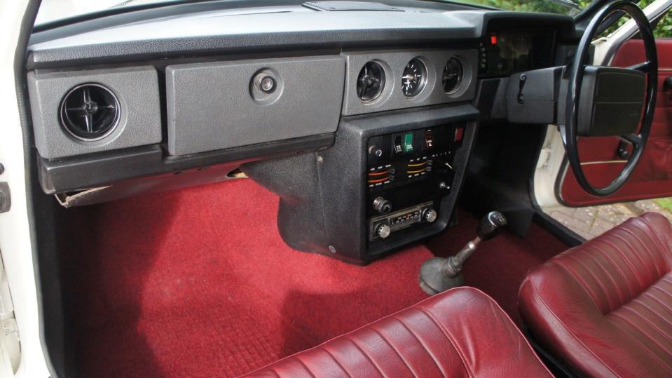 This model features authentic original red trim from 1975