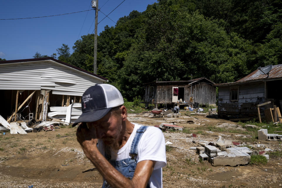 Image: Delbert White wipes sweat from his face in front of his home in Caney, Ky., on Aug. 3, 2022. (Michael Swensen for NBC News)