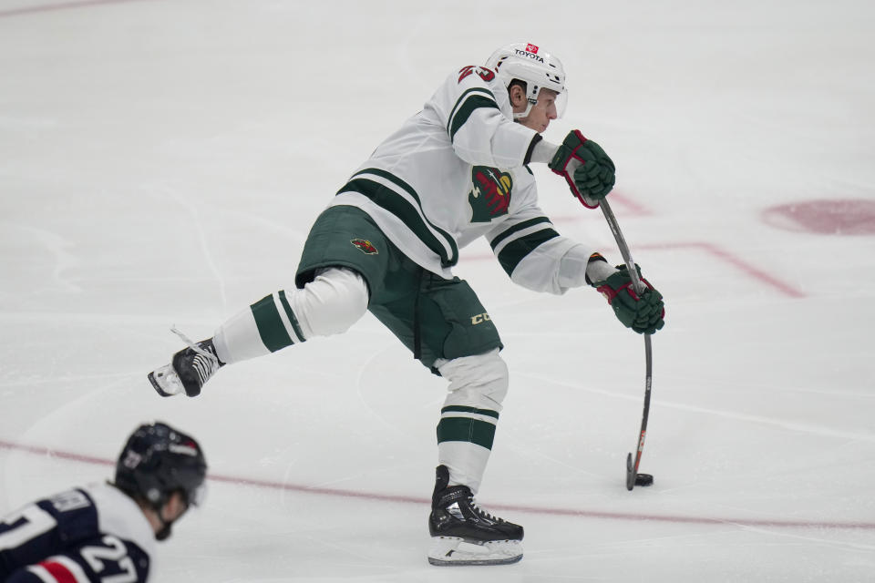 Minnesota Wild center Marco Rossi shoots for a goal against the Washington Capitals during the first period of an NHL hockey game Friday, Oct. 27, 2023, in Washington. (AP Photo/Alex Brandon)