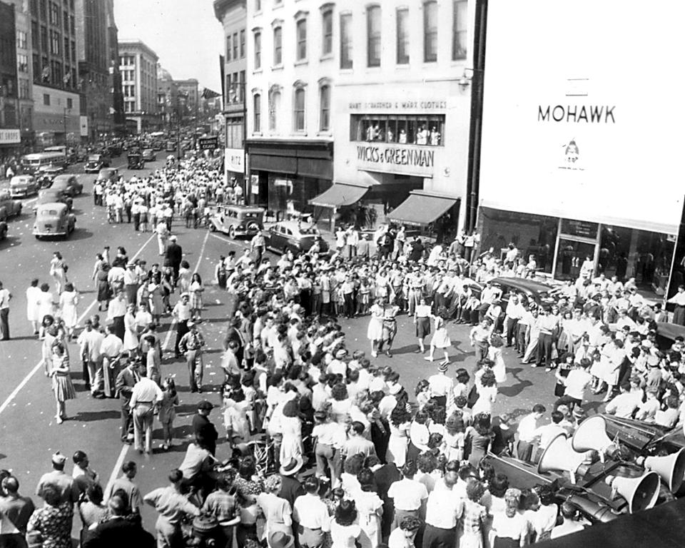 Hundreds of Uticans gathered at Franklin Square in downtown Utica on a Monday morning on August 13, 1945, to celebrate the end of World War II. On Sunday, a radio broadcast had reported that Japan had surrendered, touching off noisy celebration throughout the city. The radio report, however, was false. But that did not stop a war-weary world from making merry. The next day—August 14, a Tuesday—Japan did indeed surrender and on Sept. 2, 1945, President Harry Truman proclaimed V-J Day (victory over Japan).