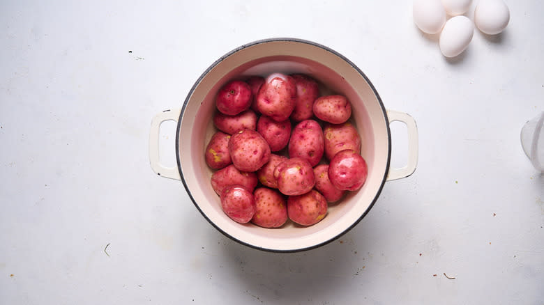 potatoes covered in water in pot