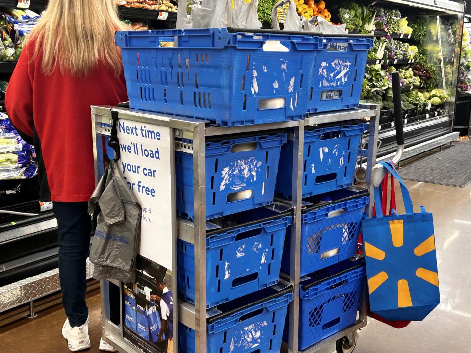 Walmart employee fulfilling Instacart orders in produce aisle, North Carolina. (Photo by: Lindsey Nicholson/UCG/Universal Images Group via Getty Images)
